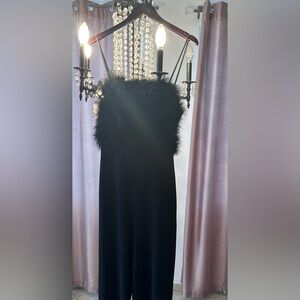 Black jumpsuit with zipper on the back.